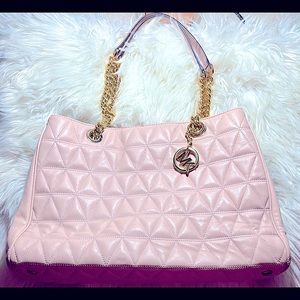Michael Kors light pink quilted purse with gold chain straps and emblem